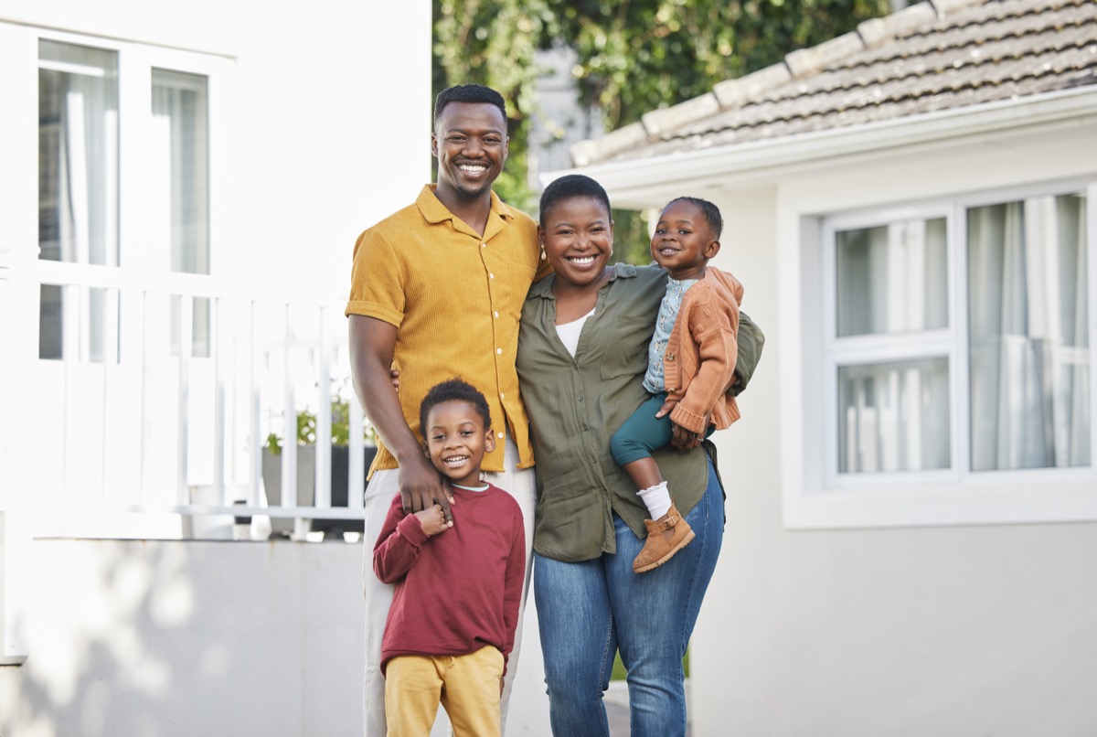 Ghanaian family outside a residential property